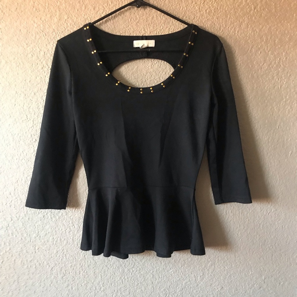 Nicky Minaj. Black with gold neckline top